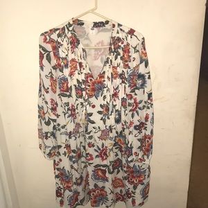 Off-white, knee-length dress.